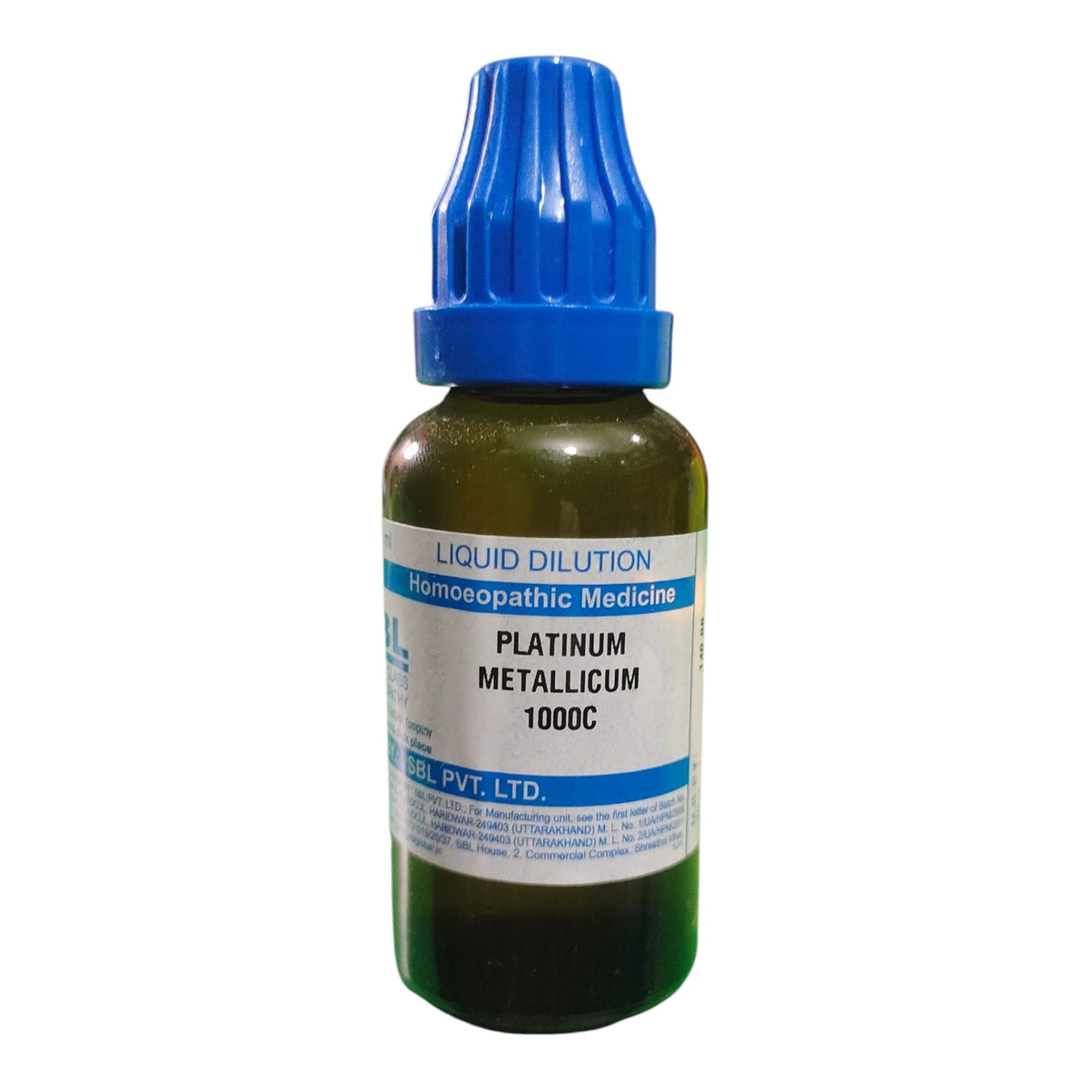 A small dark green glass bottle of homeopathic liquid dilution with a blue ribbed cap and a white label reading 'PLATINUM METALLICUM 1000C' by Homeopathic Medicine / DPL PVT, LTD.
