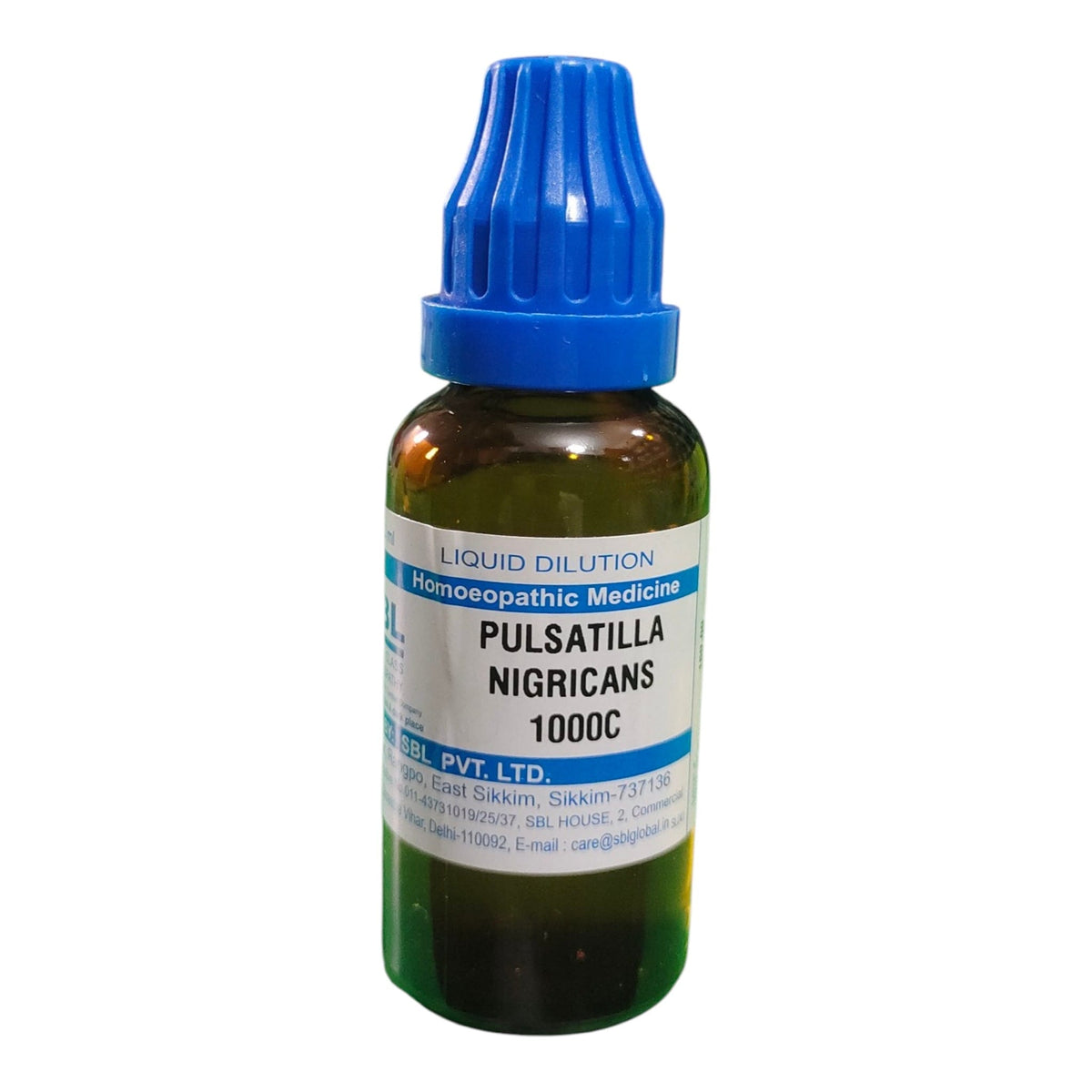 A small amber glass dropper bottle of Pulsatilla Nigricans 1000C liquid dilution by Sanskritic Pvt. Ltd.