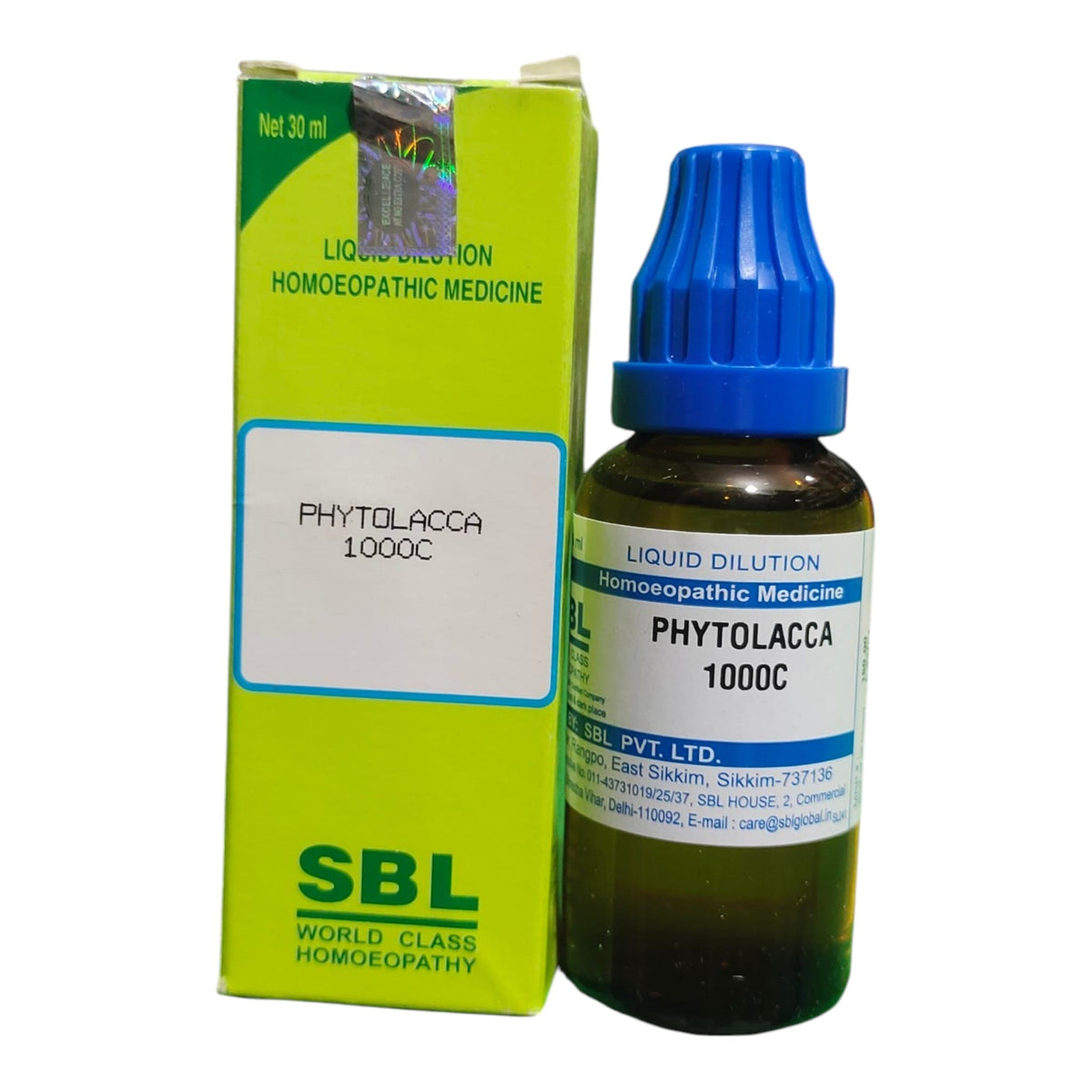A bottle of SBL World Class Homoeopathy Phytolacca 1000C liquid dilution medicine next to its lime green and white cardboard packaging box, on a plain white background.