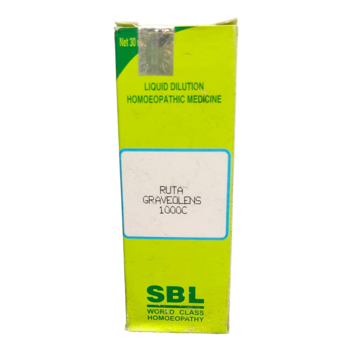 A tall lime green cardboard box of SBL World Class Homoeopathy Liquid Dilution, featuring a white label with 'RUTA GRAVEDOENS 1000C' and green text.