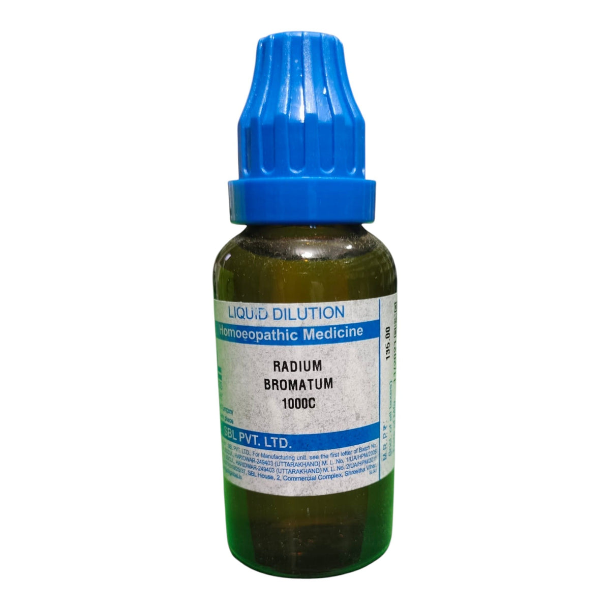 A small amber glass bottle of liquid dilution/homeopathic medicine with a blue dropper cap and a white label reading 'RADIUM BROMATUM 1000C' and 'PVT. LTD'.