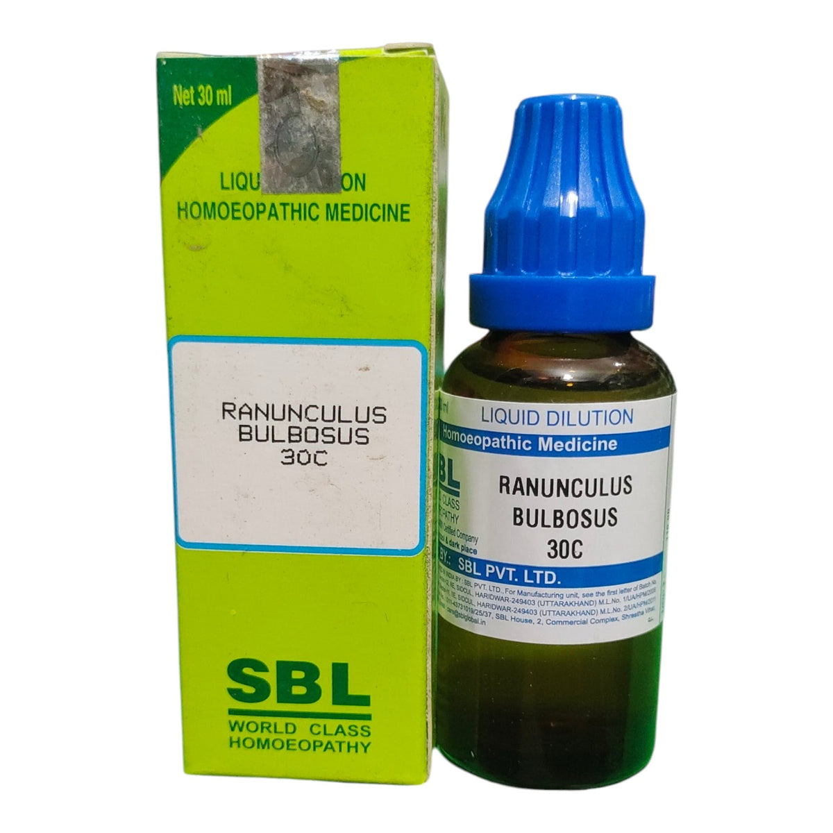 A bottle of SBL Ranunculus Bulbosus 30C homeopathic liquid medicine next to its lime green and white cardboard packaging box, on a plain white background.