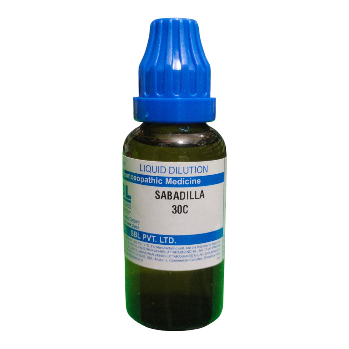 A small amber glass dropper bottle of Sabadilla liquid dilutionopathic medicine with a blue cap and white label, on a plain white background.