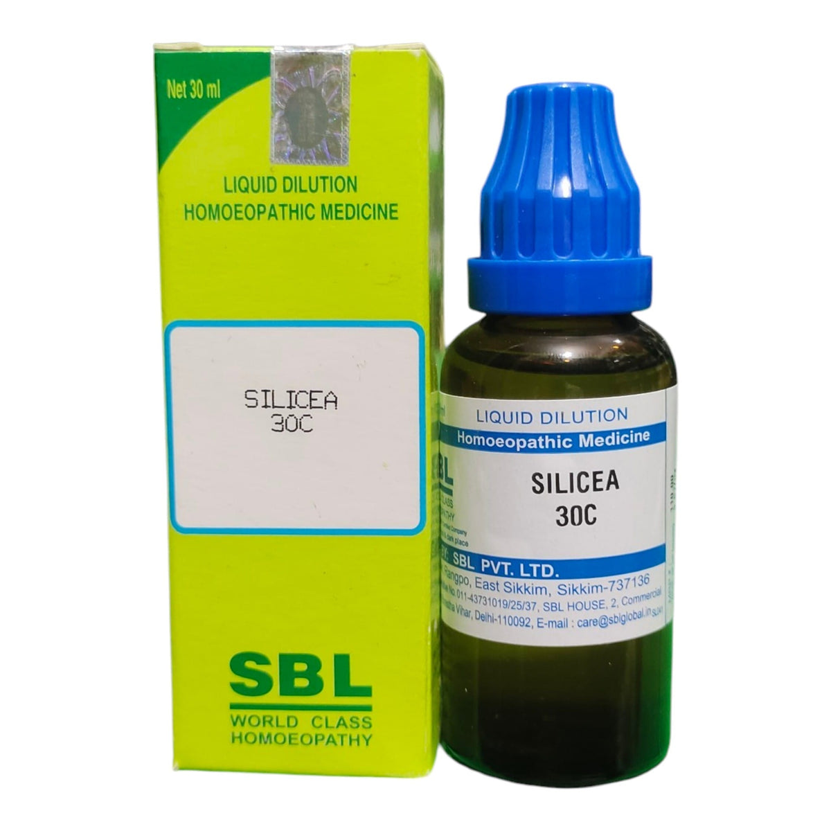 A bottle of SBL Liquid Dilution Homeopathic Medicine 'Silicea 30C' next to its lime green and white packaging box, on a plain white background.