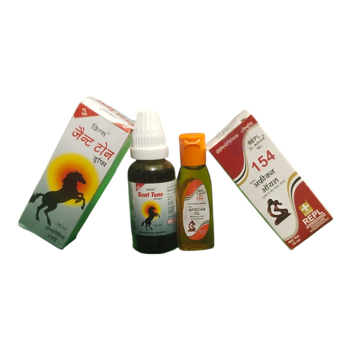 Two product boxes and two small bottles arranged on a plain white background. The packaging features Hindi text, a horse silhouette, and red, white, and green graphics.