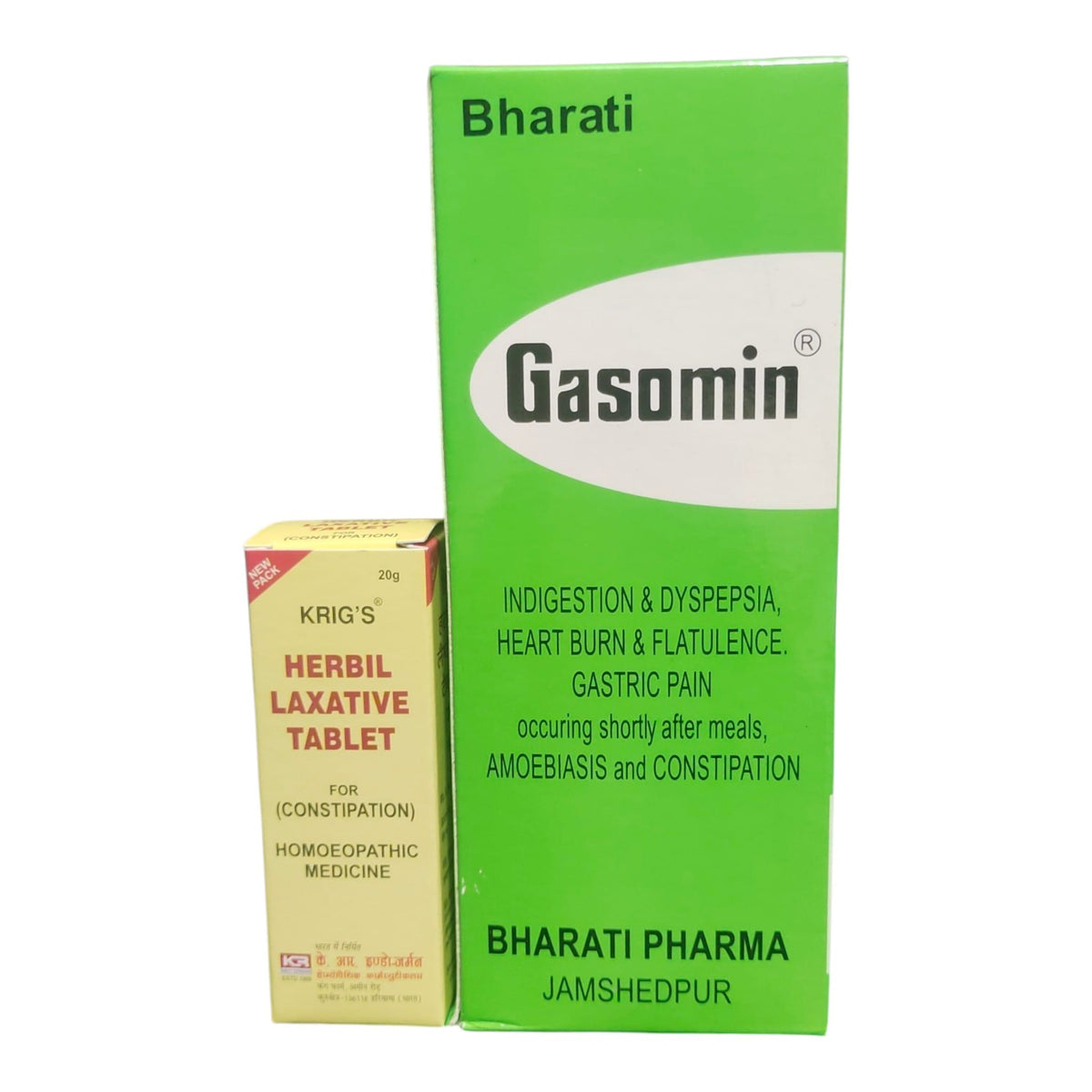 Gasomin Herbal Laxative Tablet packaging showing a large green and white box of Bharati Pharma and a smaller cream-colored box of Krig's Herbal Laxative Tablet next to it, on a white background.
