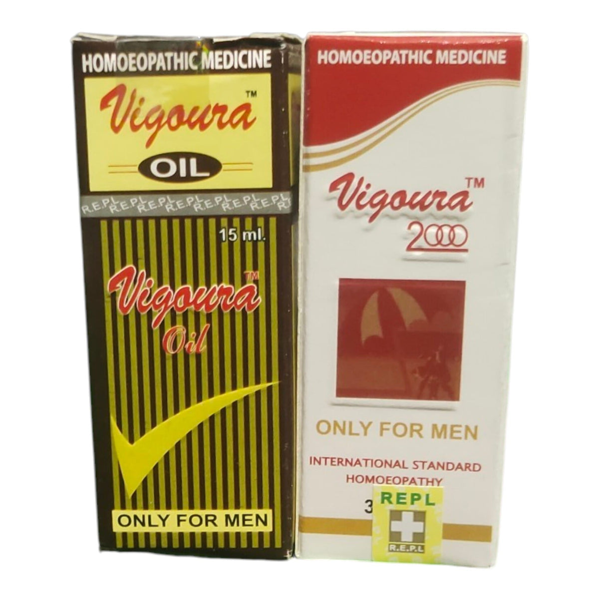 Two boxes of Vigoura Homeopathic Medicine side by side on a white background. The left box is black with yellow stripes and a yellow label, labeled 'Vigoura Oil 15 ml'.