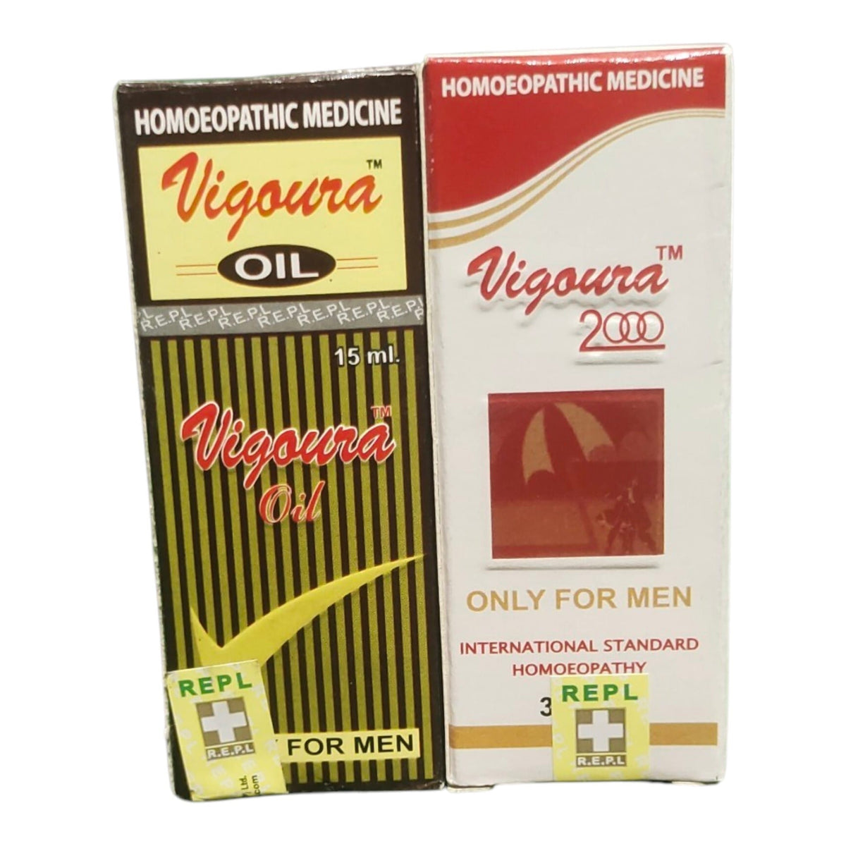 Two boxes of Vigoura 2000 Homoeopathic Medicine side by side on a white background. The left box is black and yellow striped with red and gold text, and the right box is white with a red header and a small red umbrella graphic.