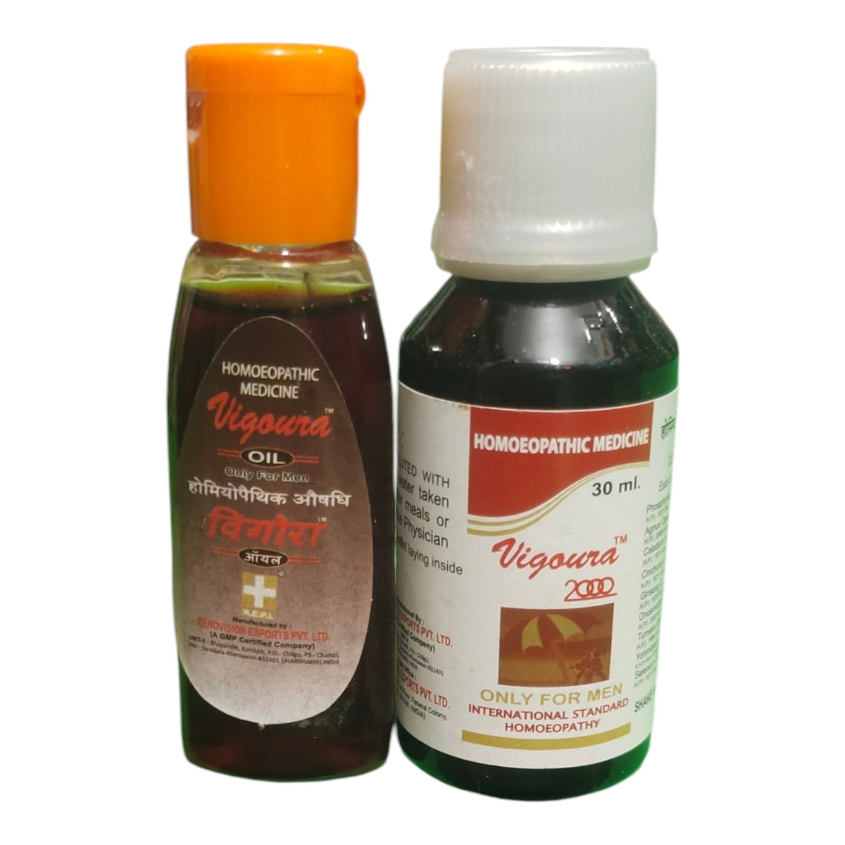 Two bottles of homeopathic medicine, Vigoura Oil and Vigoura 2000, displayed side-by-side on a plain white background.