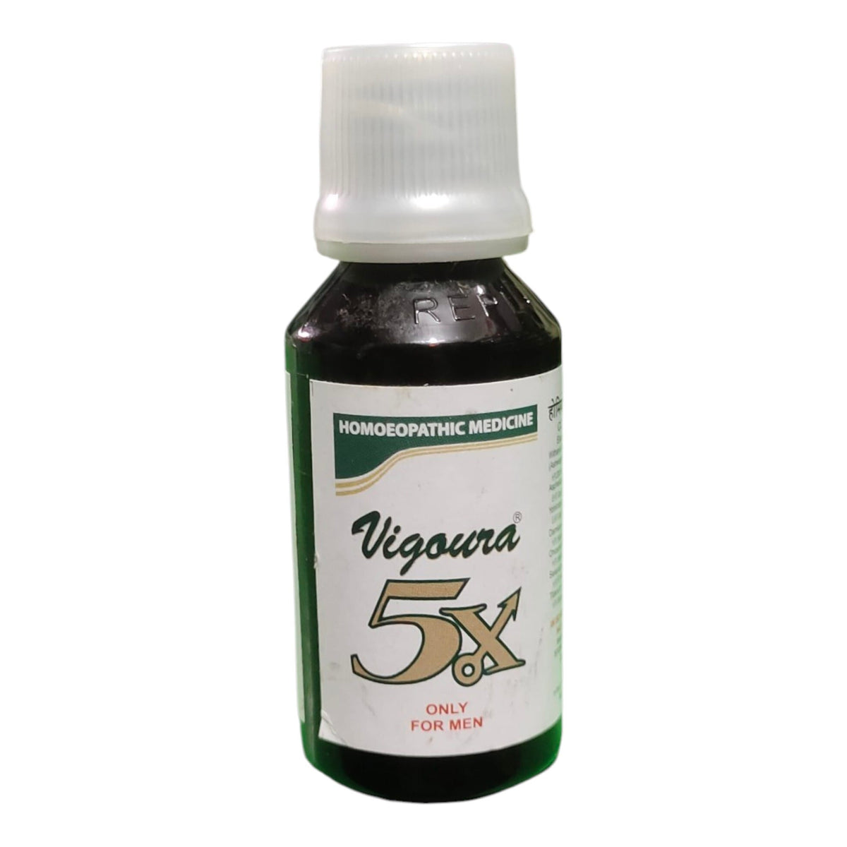 A bottle of Vigoura 5x homeopathic medicine, featuring a dark amber glass bottle with a white cap and a white label with green and gold text.