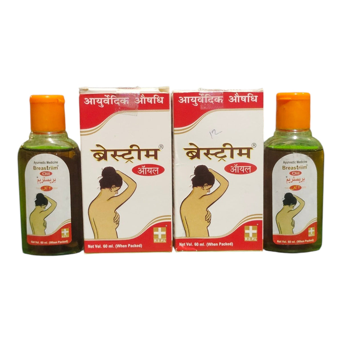 Two bottles of Braided Breast Oil with orange caps and two matching retail boxes, all labeled in Hindi, shown on a plain white background.