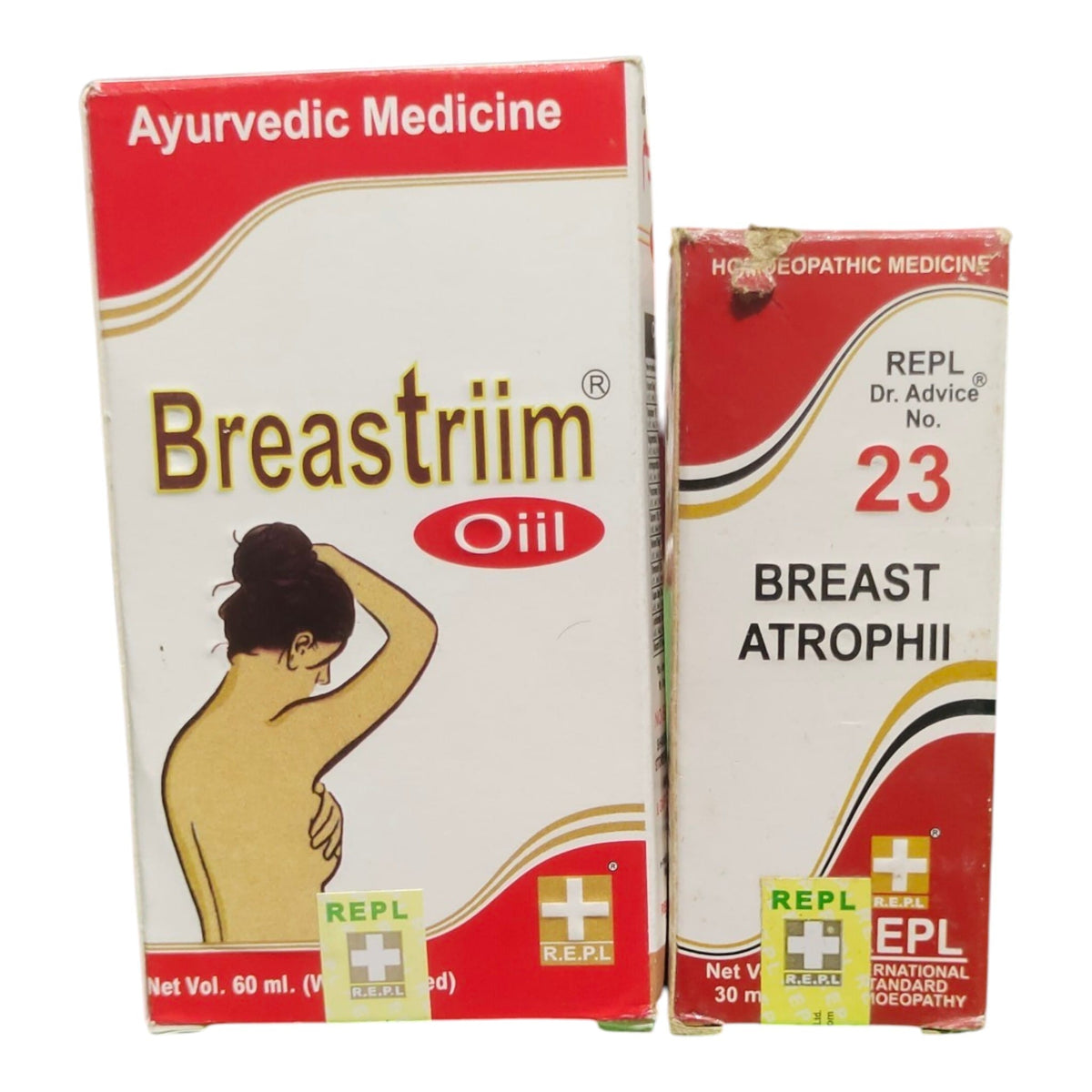 Two product boxes for REPL Breast Strium Oil Ayurvedic Medicine side by side on a white background. The larger box on the left is labeled 'Breastrim Oil' and depicts a graphic of a woman holding her breast.