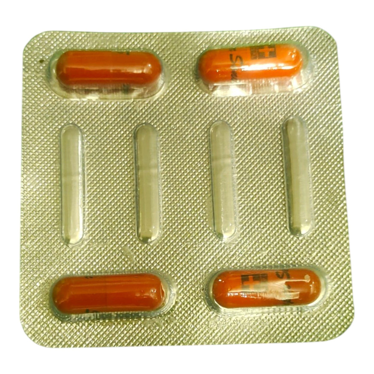 A blister pack containing five orange-brown capsules, with two capsules visible in the top row and three in the bottom row, set against a plain white background.