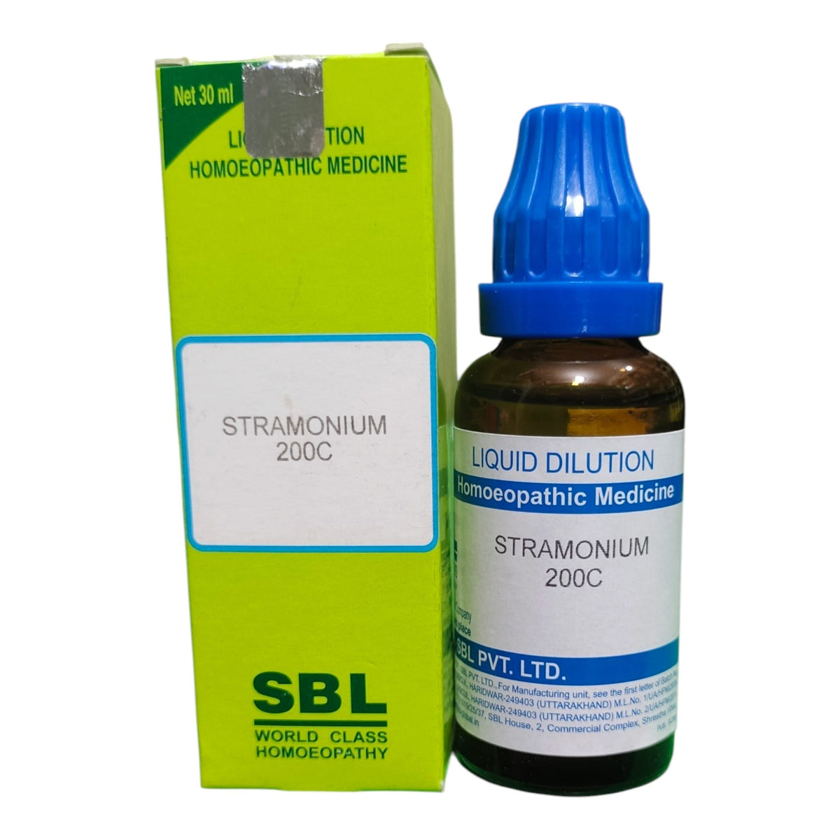 A bottle of SBL Stramonium 200C homeopathic liquid medicine next to its lime green box, on a plain white background.