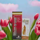 Two boxes of Similia Vitality of Hair product with pink tulips in the background