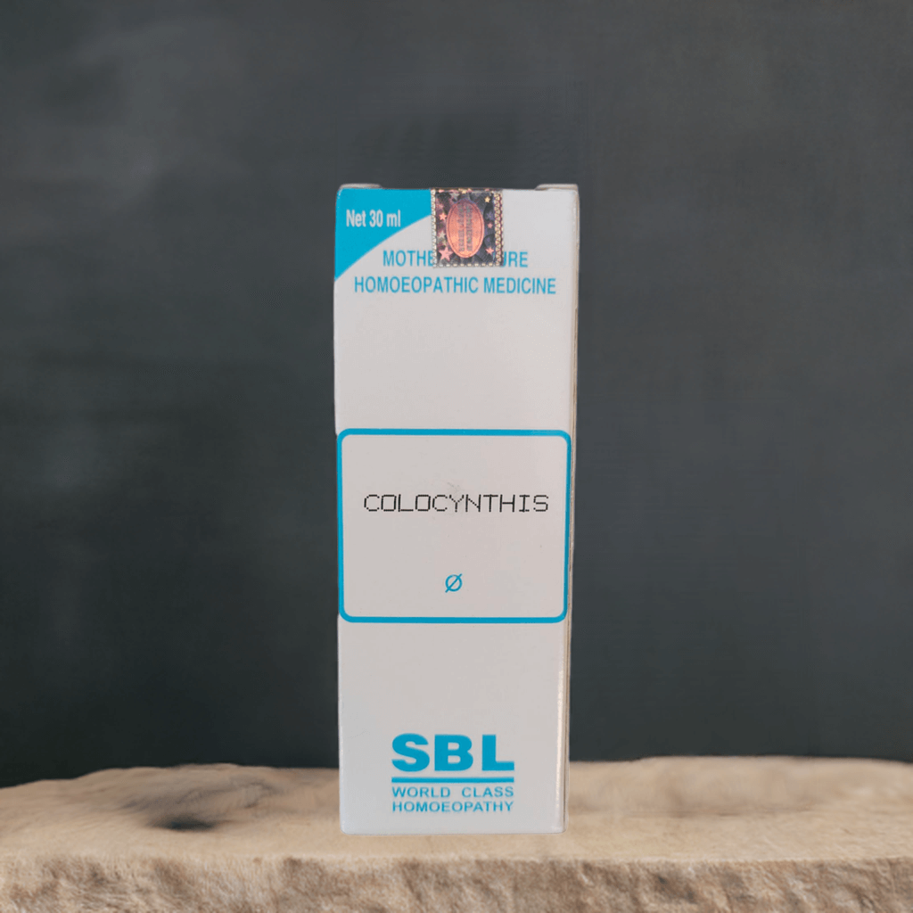 SBL Colocynthis homeopathic medicine box on a wooden surface with a dark background