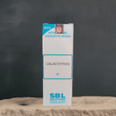 SBL Colocynthis homeopathic medicine box on a wooden surface with a dark background